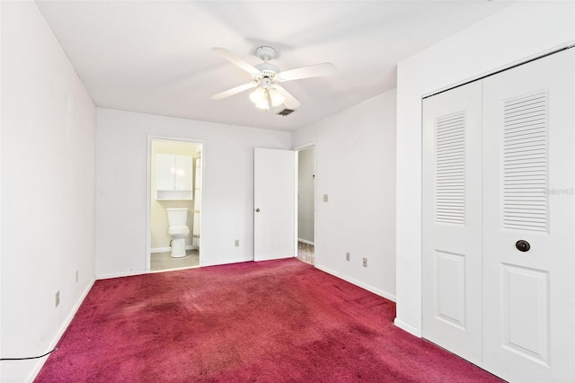1101 Oregon Ave, Saint Cloud, FL 34769 - unfurnished bedroom with carpet, a closet, ensuite bathroom, and a ceiling fan
