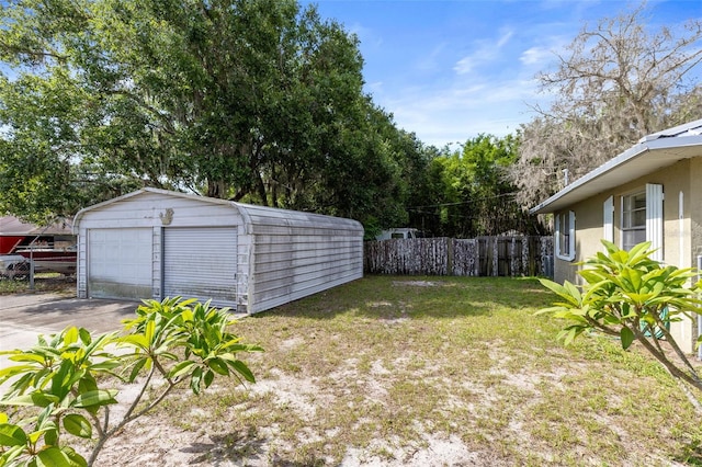 1101 Oregon Ave, Saint Cloud, FL 34769 - view of yard featuring an outdoor structure and a detached garage