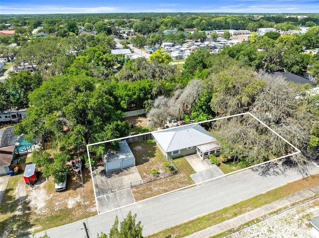 1101 Oregon Ave, Saint Cloud, FL 34769 - aerial overview of property's location with a tree filled landscape and property boundaries highlighted