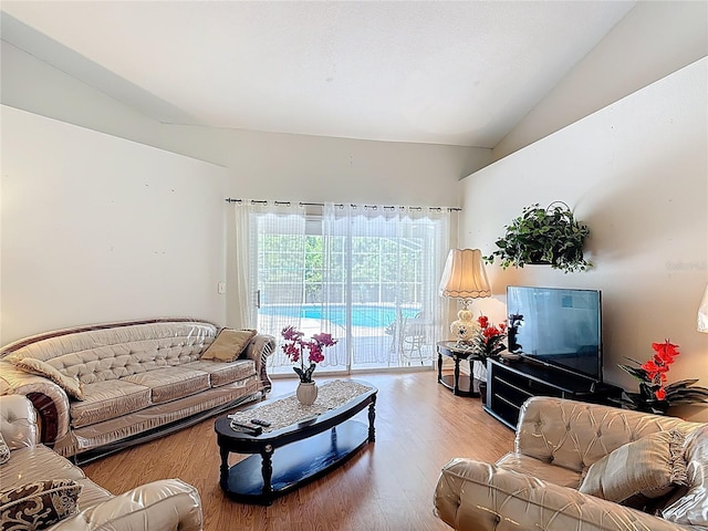 3158 Forest Breeze Way, Saint Cloud, FL 34771 - living area with vaulted ceiling and wood finished floors