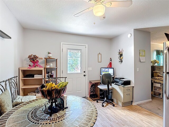 3158 Forest Breeze Way, Saint Cloud, FL 34771 - office space featuring a textured ceiling, light wood-style floors, and ceiling fan