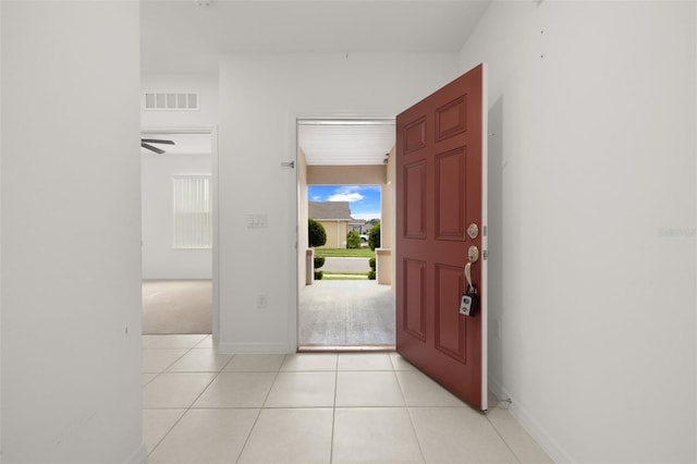 371 Pinecrest Loop, Davenport, FL 33837 - foyer featuring light tile patterned floors and light colored carpet