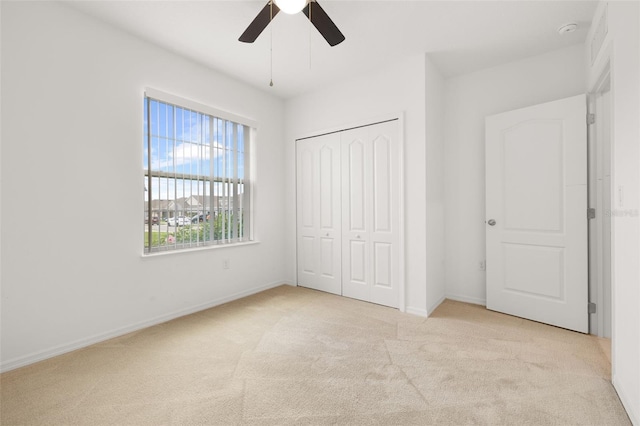 371 Pinecrest Loop, Davenport, FL 33837 - unfurnished bedroom with carpet flooring, a closet, and a ceiling fan