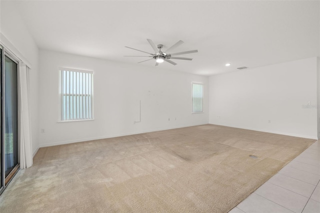 371 Pinecrest Loop, Davenport, FL 33837 - spare room featuring a ceiling fan, light carpet, recessed lighting, and light tile patterned flooring