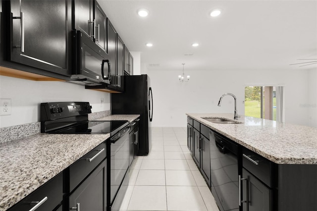 371 Pinecrest Loop, Davenport, FL 33837 - kitchen featuring black appliances, dark cabinets, a chandelier, a kitchen island with sink, and recessed lighting