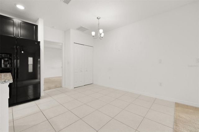 371 Pinecrest Loop, Davenport, FL 33837 - kitchen with black fridge, dark cabinets, a chandelier, decorative light fixtures, and recessed lighting