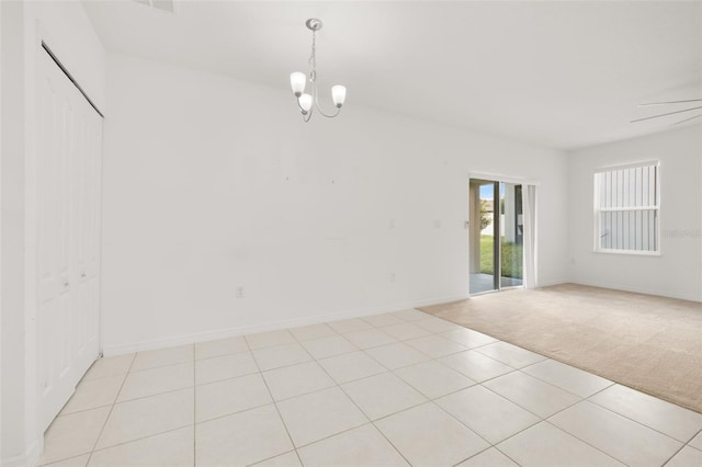 371 Pinecrest Loop, Davenport, FL 33837 - spare room with light colored carpet, a chandelier, and light tile patterned floors
