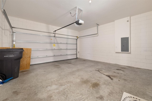 371 Pinecrest Loop, Davenport, FL 33837 - garage with electric panel, a garage door opener, and concrete block wall