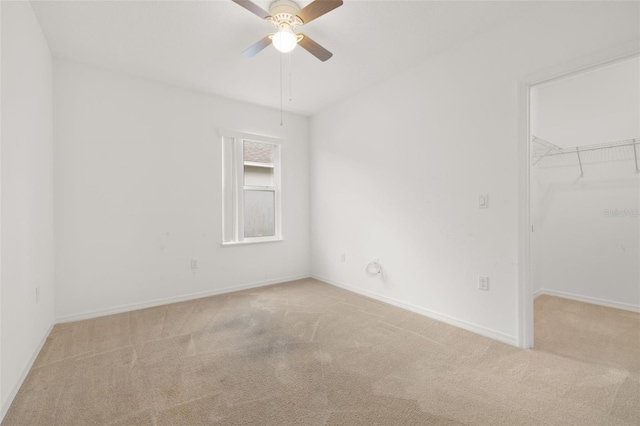371 Pinecrest Loop, Davenport, FL 33837 - unfurnished bedroom with carpet flooring, a walk in closet, a closet, and ceiling fan