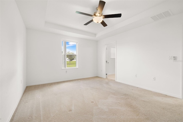 371 Pinecrest Loop, Davenport, FL 33837 - empty room with a raised ceiling, a ceiling fan, and light carpet