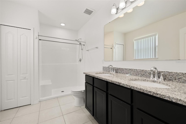 371 Pinecrest Loop, Davenport, FL 33837 - full bathroom featuring a closet, tile patterned flooring, a tile shower, and double vanity