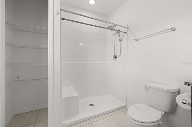 371 Pinecrest Loop, Davenport, FL 33837 - bathroom with a stall shower, tile patterned flooring, and a spacious closet