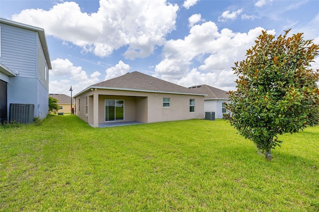 371 Pinecrest Loop, Davenport, FL 33837 - back of house with a patio area, stucco siding, and a lawn