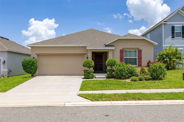 371 Pinecrest Loop, Davenport, FL 33837 - view of front of house featuring a garage, stucco siding, concrete driveway, roof with shingles, and a front lawn