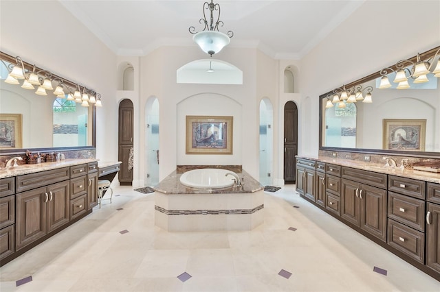 9905 Lanai View Ct, Windermere, FL 34786 - full bathroom featuring two vanities, a garden tub, ornamental molding, tile patterned floors, and a high ceiling