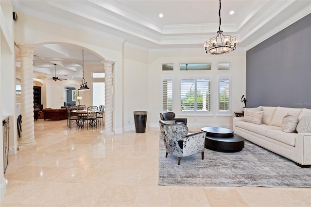 9905 Lanai View Ct, Windermere, FL 34786 - living area featuring ornate columns, ceiling fan, arched walkways, a tray ceiling, and ornamental molding