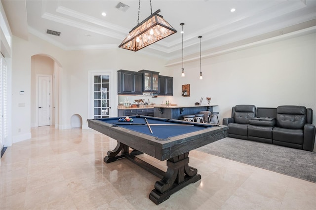 9905 Lanai View Ct, Windermere, FL 34786 - recreation room featuring a tray ceiling, arched walkways, crown molding, pool table, and bar