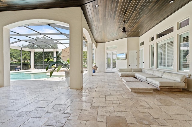 9905 Lanai View Ct, Windermere, FL 34786 - view of patio / terrace with french doors, an outdoor pool, ceiling fan, glass enclosure, and an outdoor hangout area