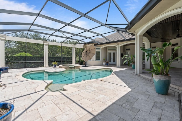 9905 Lanai View Ct, Windermere, FL 34786 - view of pool with french doors, a patio area, a pool with connected hot tub, and glass enclosure