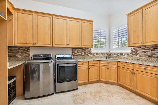 9905 Lanai View Ct, Windermere, FL 34786 - laundry room with washing machine and dryer and cabinet space