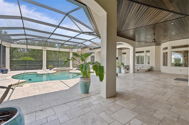 9905 Lanai View Ct, Windermere, FL 34786 - view of swimming pool featuring a patio area, a pool with connected hot tub, ceiling fan, and a lanai