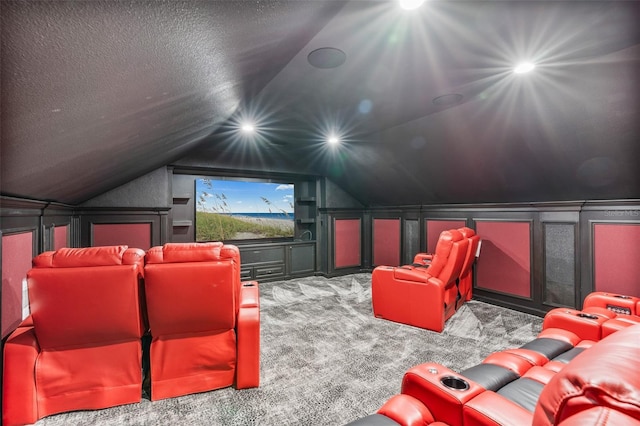 9905 Lanai View Ct, Windermere, FL 34786 - carpeted cinema room featuring vaulted ceiling, a decorative wall, and a textured ceiling