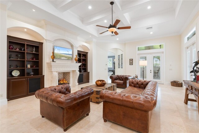 9905 Lanai View Ct, Windermere, FL 34786 - living area with arched walkways, coffered ceiling, beam ceiling, recessed lighting, and a high ceiling
