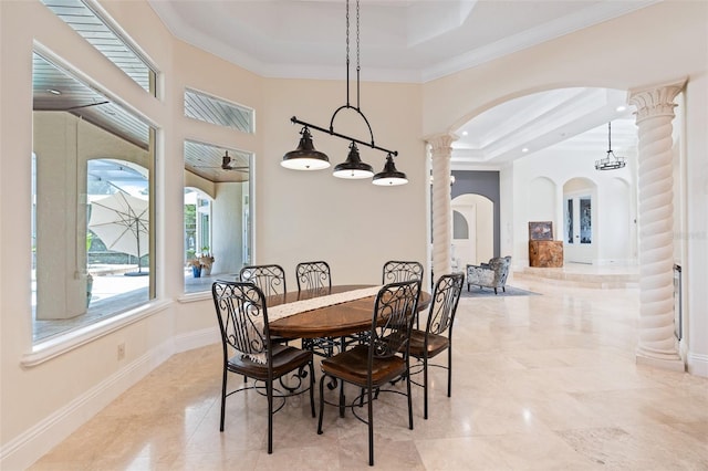 9905 Lanai View Ct, Windermere, FL 34786 - dining area with arched walkways, a raised ceiling, decorative columns, crown molding, and a high ceiling