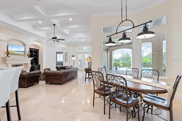 9905 Lanai View Ct, Windermere, FL 34786 - dining space with ceiling fan, beamed ceiling, coffered ceiling, a premium fireplace, and recessed lighting