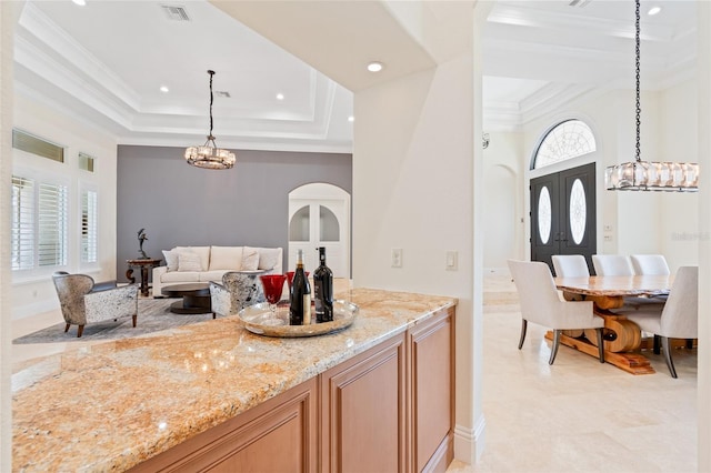 9905 Lanai View Ct, Windermere, FL 34786 - kitchen with a raised ceiling, light stone countertops, ornamental molding, a chandelier, and recessed lighting