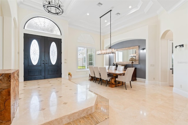 9905 Lanai View Ct, Windermere, FL 34786 - foyer entrance featuring a chandelier, arched walkways, crown molding, a high ceiling, and recessed lighting