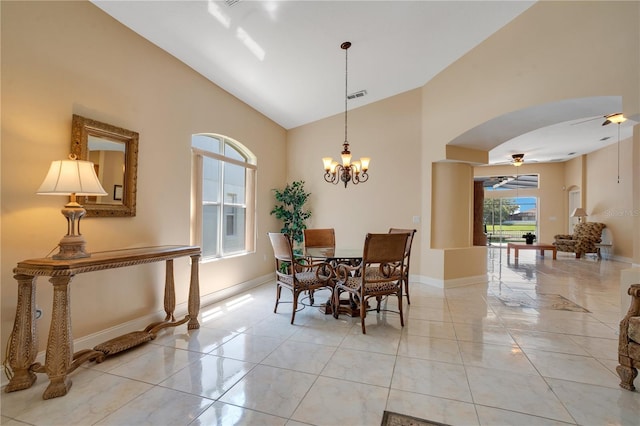 746 Stonewyk Way, Kissimmee, FL 34744 - dining room with ceiling fan, arched walkways, high vaulted ceiling, a chandelier, and light tile patterned floors