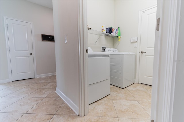4928 Cortland Dr, Davenport, FL 33837 - laundry room with independent washer and dryer and light tile patterned floors