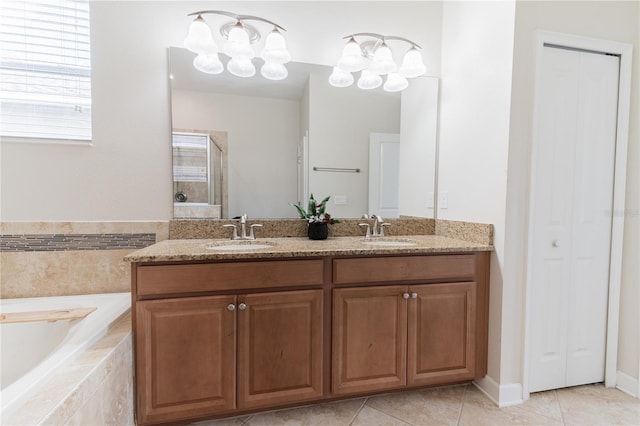 4928 Cortland Dr, Davenport, FL 33837 - bathroom featuring a closet, double vanity, a bath, tile patterned flooring, and a shower with door