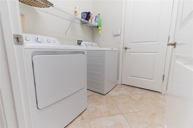 4928 Cortland Dr, Davenport, FL 33837 - laundry area featuring washer and dryer and light tile patterned flooring