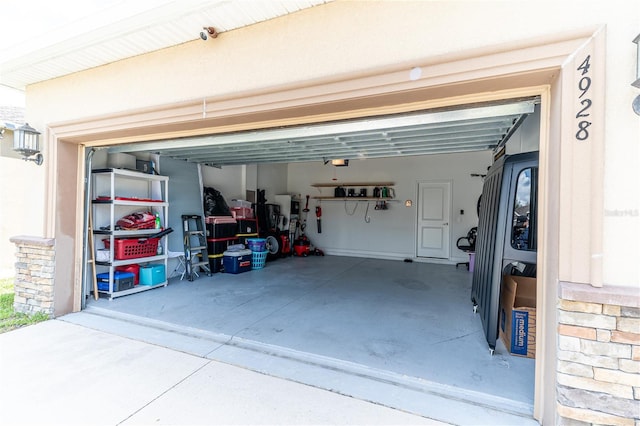 4928 Cortland Dr, Davenport, FL 33837 - garage with a garage door opener and concrete driveway