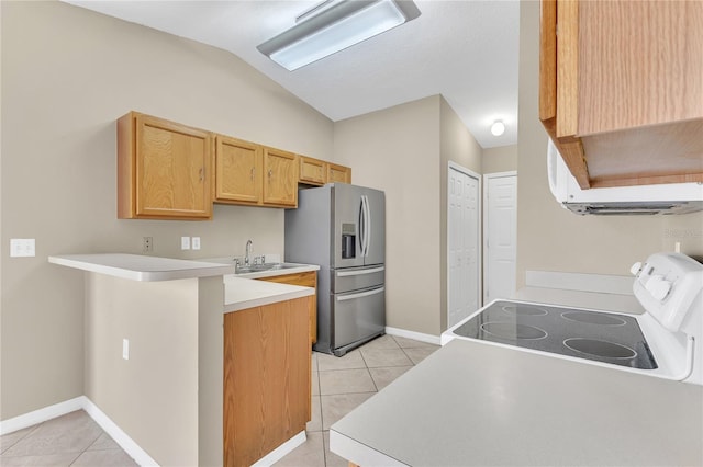 107 Whitehall Way, Kissimmee, FL 34758 - kitchen featuring stainless steel fridge, electric stove, light tile patterned floors, vaulted ceiling, and a peninsula