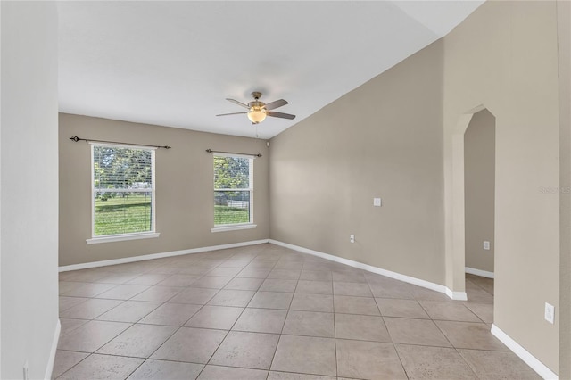 107 Whitehall Way, Kissimmee, FL 34758 - spare room with ceiling fan, light tile patterned floors, vaulted ceiling, and arched walkways