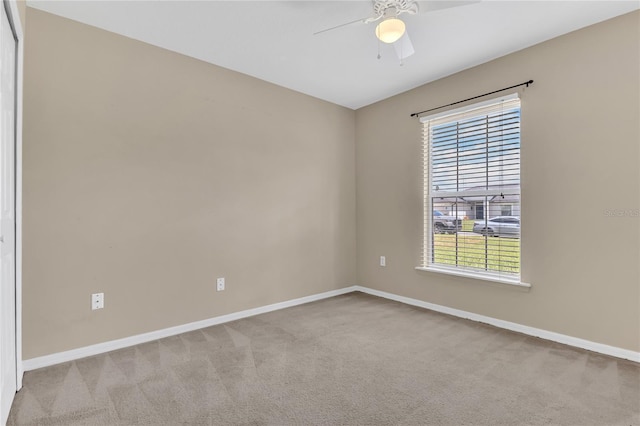 107 Whitehall Way, Kissimmee, FL 34758 - unfurnished room featuring light carpet, healthy amount of natural light, and a ceiling fan