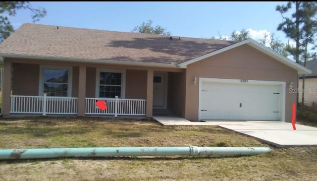 110 Sparrow Ct Unit 9, Kissimmee, FL 34759 - ranch-style house with a porch, an attached garage, concrete driveway, a shingled roof, and stucco siding