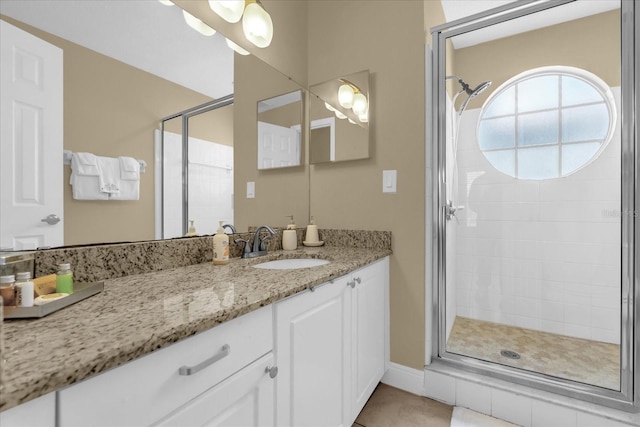 2737 N Poinciana Blvd Unit 92, Kissimmee, FL 34746 - bathroom with a stall shower, vanity, and tile patterned floors