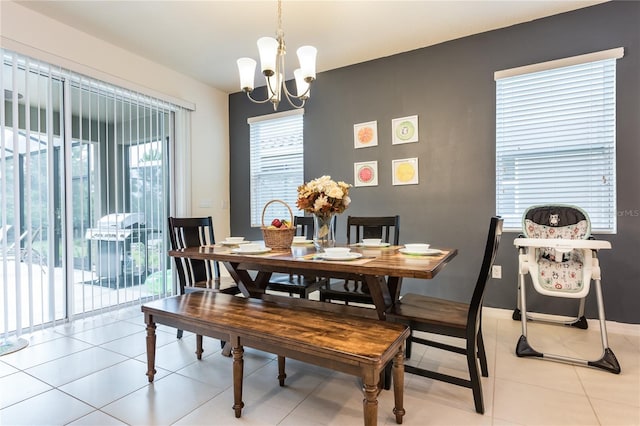 5231 Wildwood Way, Davenport, FL 33837 - dining room featuring a chandelier and light tile patterned floors