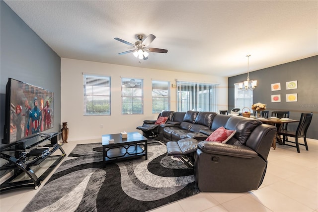 5231 Wildwood Way, Davenport, FL 33837 - living area featuring a chandelier, ceiling fan, light tile patterned floors, and a textured ceiling