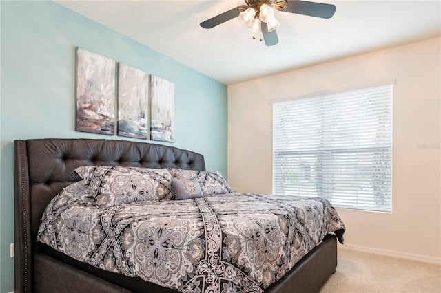 5231 Wildwood Way, Davenport, FL 33837 - carpeted bedroom with multiple windows and ceiling fan