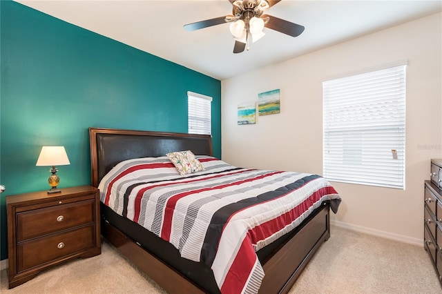 5231 Wildwood Way, Davenport, FL 33837 - bedroom featuring light colored carpet and a ceiling fan