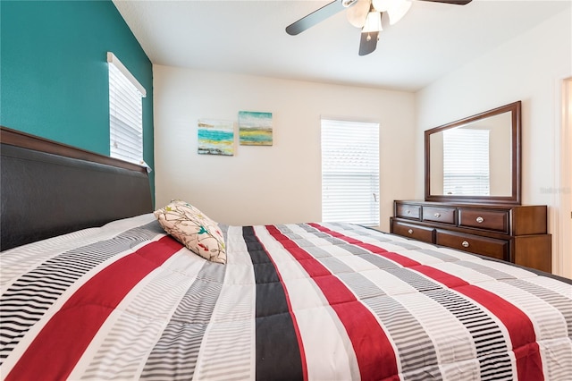 5231 Wildwood Way, Davenport, FL 33837 - bedroom with multiple windows and a ceiling fan