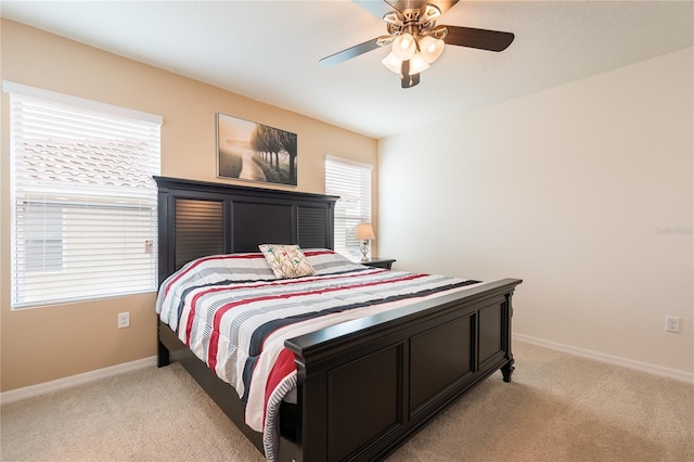 5231 Wildwood Way, Davenport, FL 33837 - bedroom featuring light carpet and a ceiling fan