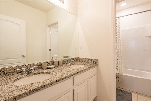 5231 Wildwood Way, Davenport, FL 33837 - bathroom featuring double vanity, shower / bath combo with shower curtain, and tile patterned floors