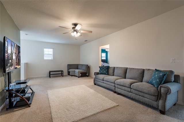 5231 Wildwood Way, Davenport, FL 33837 - carpeted living room featuring ceiling fan and baseboards