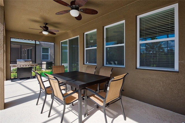5231 Wildwood Way, Davenport, FL 33837 - view of patio / terrace featuring outdoor dining space, a ceiling fan, and area for grilling